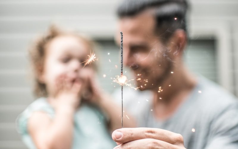 person holding sparklers